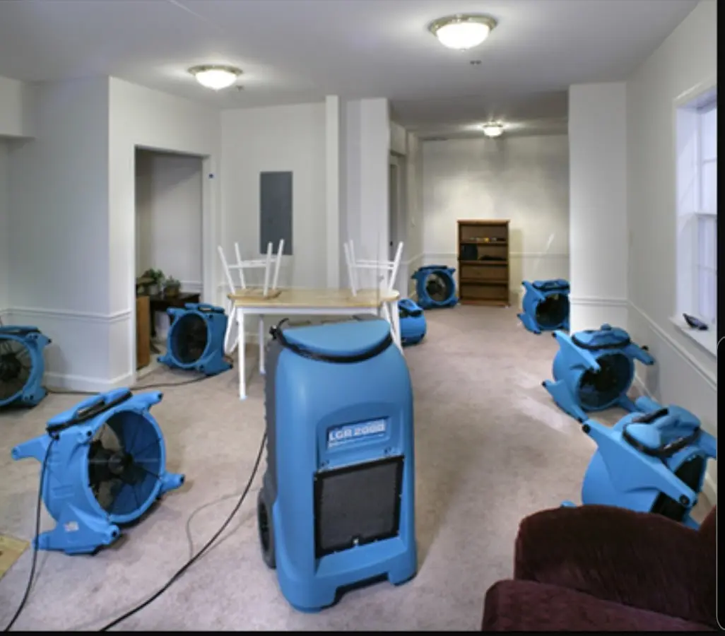 Air movers and dehumidifier setup for Water Damage Restoration in Le Roy